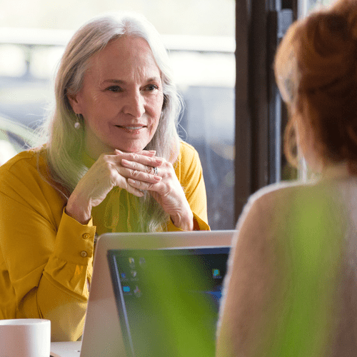 woman sitting in front of a computer at work