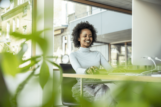 woman working at desk with laptop