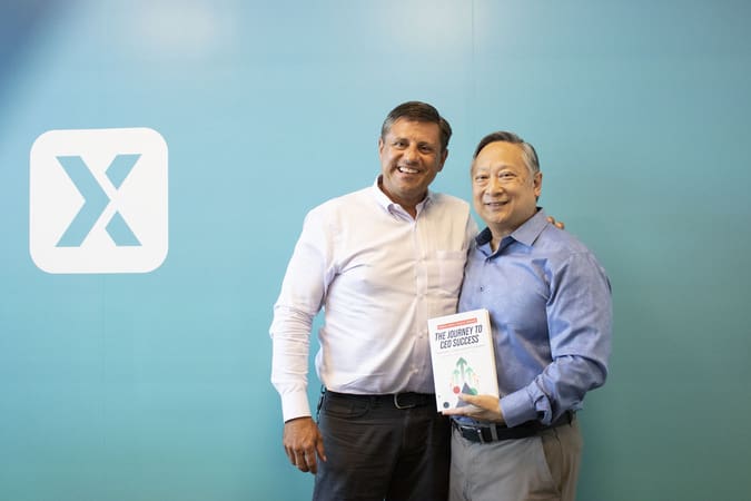 michael praeger and patrick thean holding their book