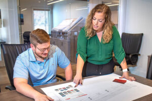 Robert High Development co-workers going over plans.