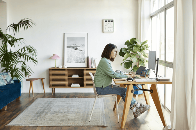 woman working at desk in home office